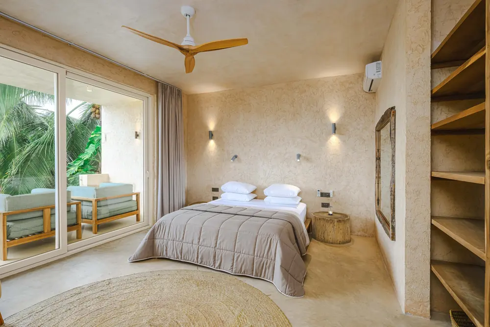 Master suite with king-size bed and pool view