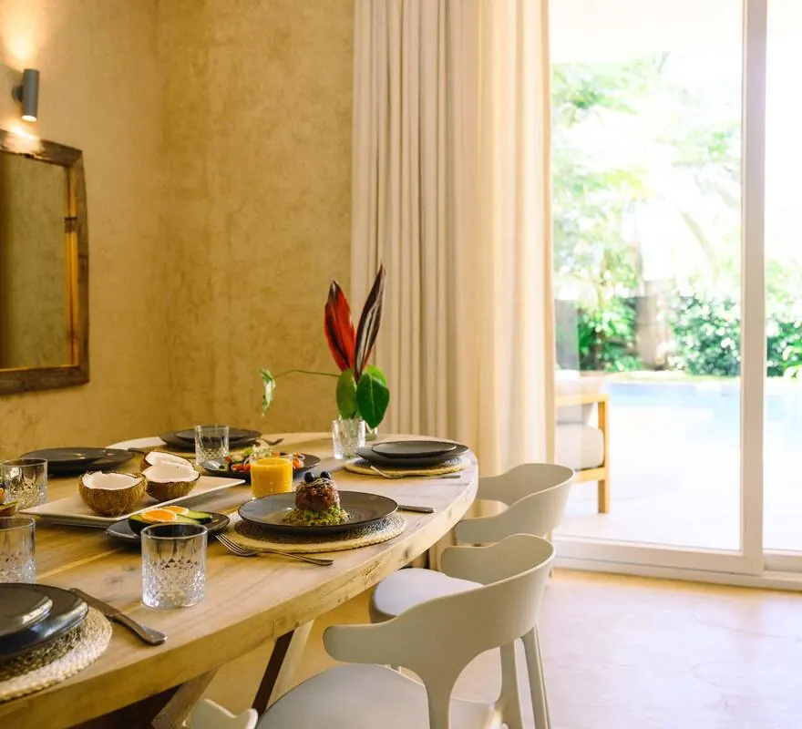 Dining room at Villa Kokos opening onto the pool