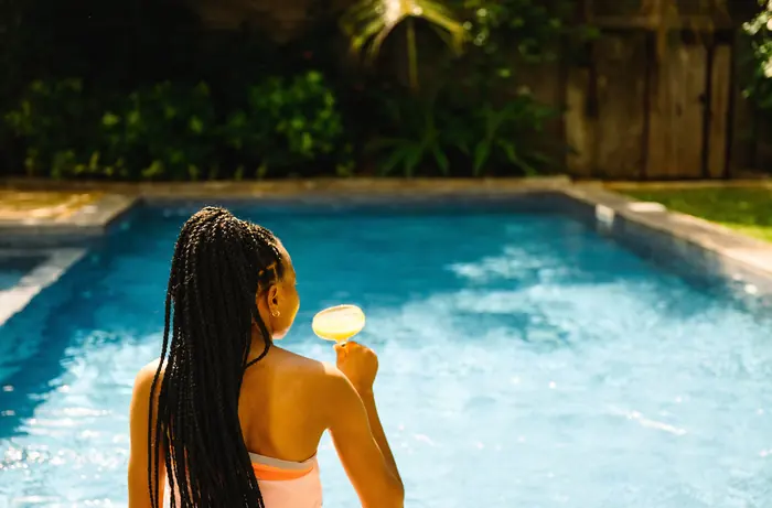 Guest relaxing in the pool at Villa Kokos, Zanzibar