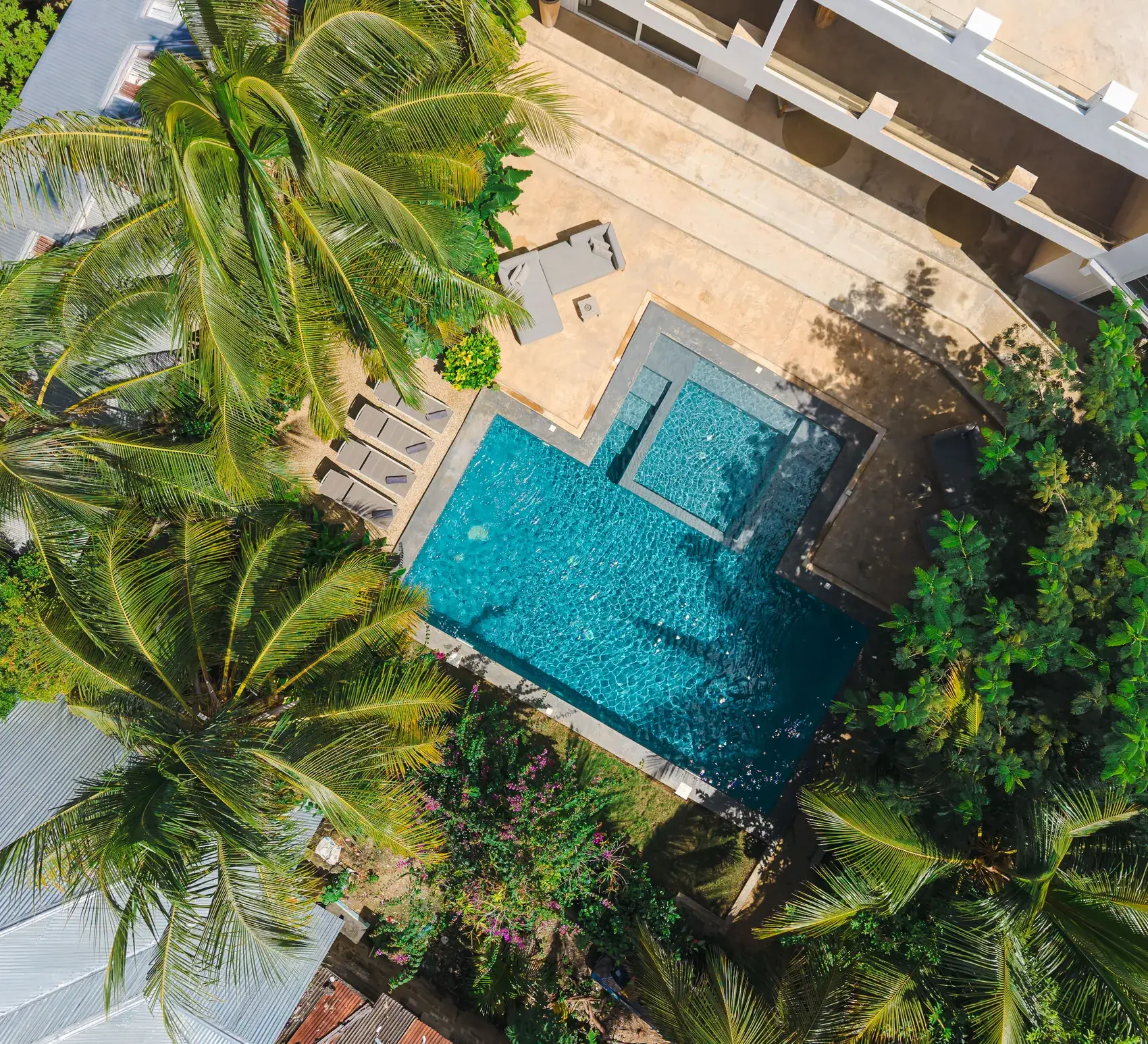 Aerial view of the pool and jacuzzi of Villa Kokos among the palms, Kiwengwa Zanzibar