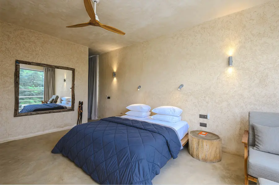 Bedroom at Villa Kokos with handcrafted wooden mirror