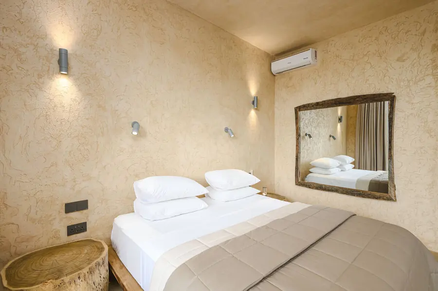 Master suite with premium white linen at Villa Kokos