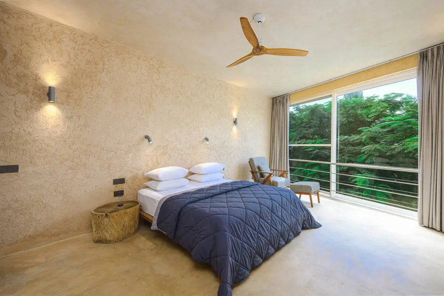 Bedroom opening onto the garden at Villa Kokos