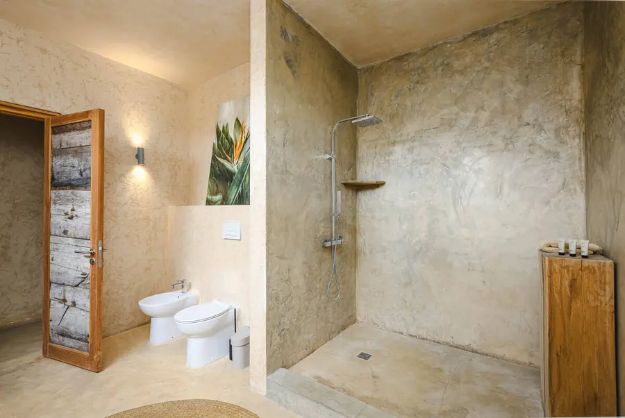 Bathroom at Villa Kokos with open shower and natural finishes